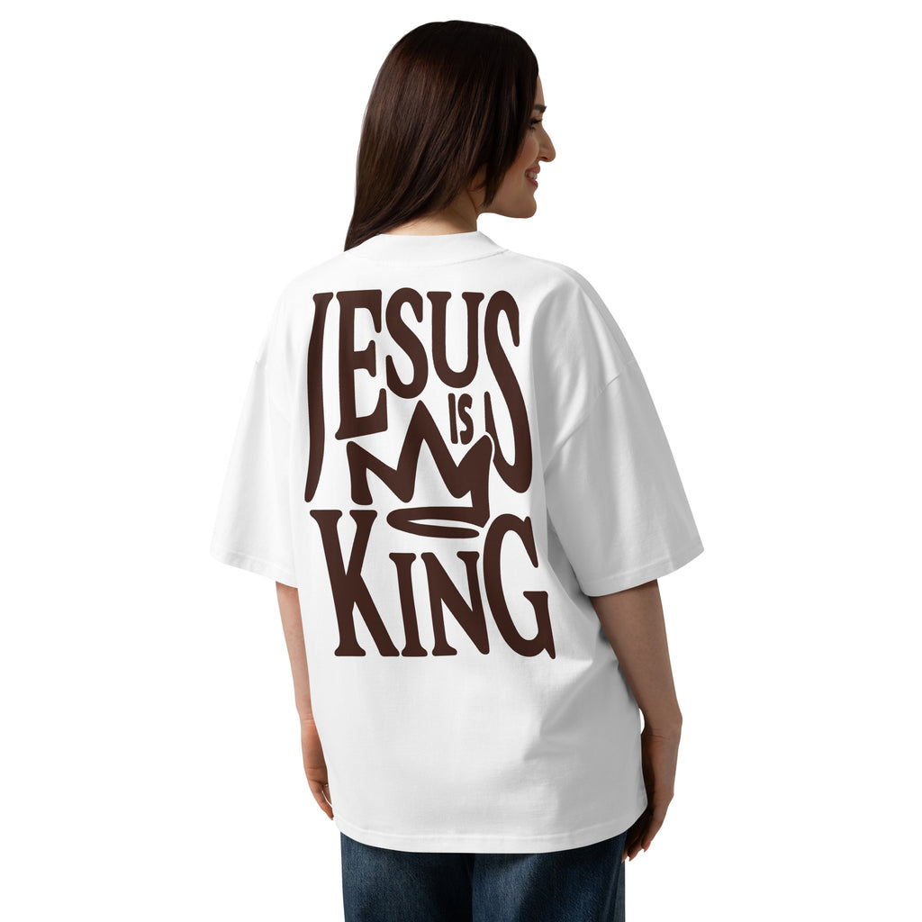 Female model wearing Oerigin's white oversized heavyweight streetwear t-shirt with "Jesus Is My King" print on the back.