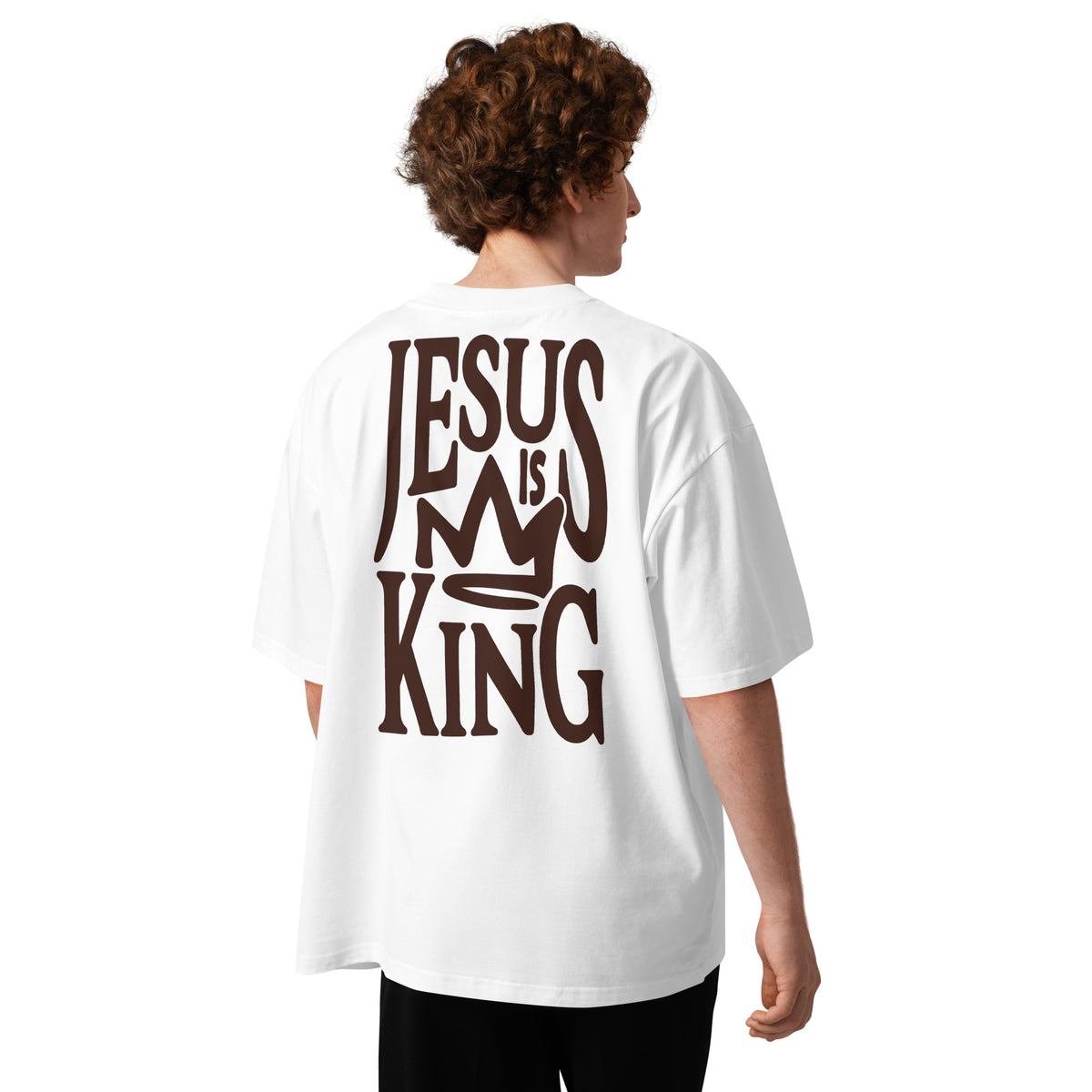 Male model wearing Oerigin's white oversized heavyweight streetwear t-shirt with "Jesus Is My King" print on the back. 