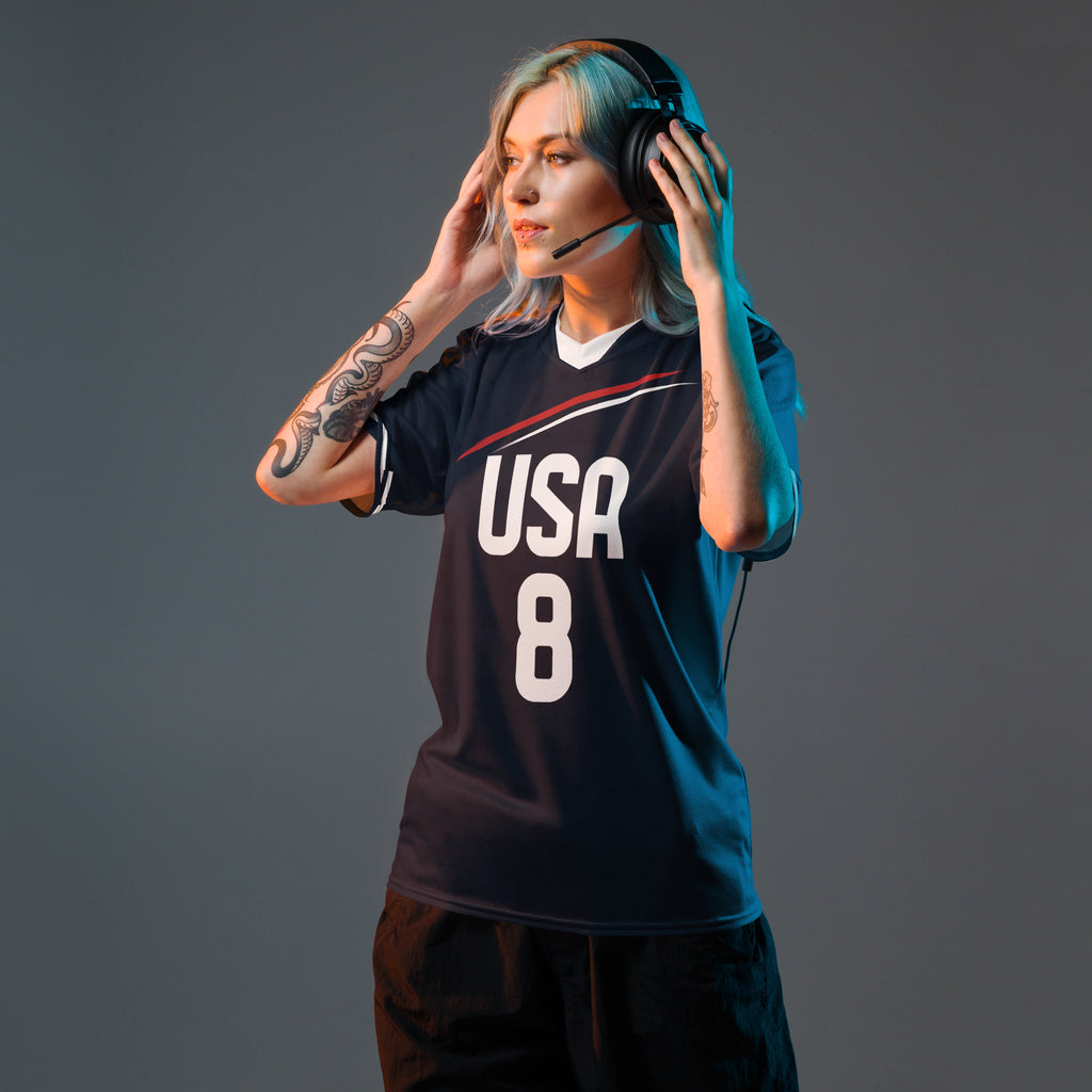 all-over-print-recycled-unisex-sports-jersey-USA-Midnight-Strike-soccer-jersey-navy-base-with-red-and-white-diagonal-strike-premium-national-team-fanwear-front-female-model-view