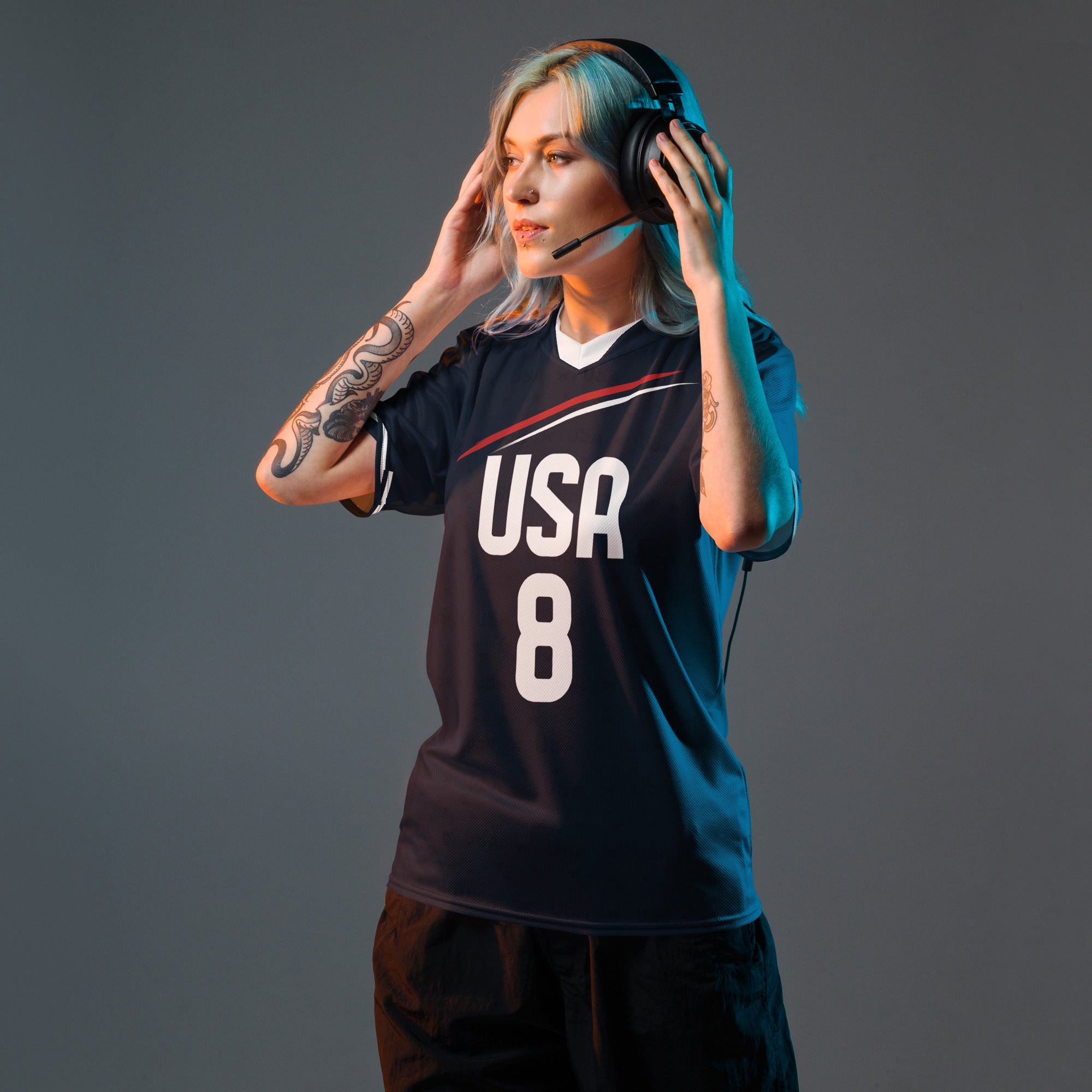 all-over-print-recycled-unisex-sports-jersey-USA-Midnight-Strike-soccer-jersey-navy-base-with-red-and-white-diagonal-strike-premium-national-team-fanwear-front-female-model-view