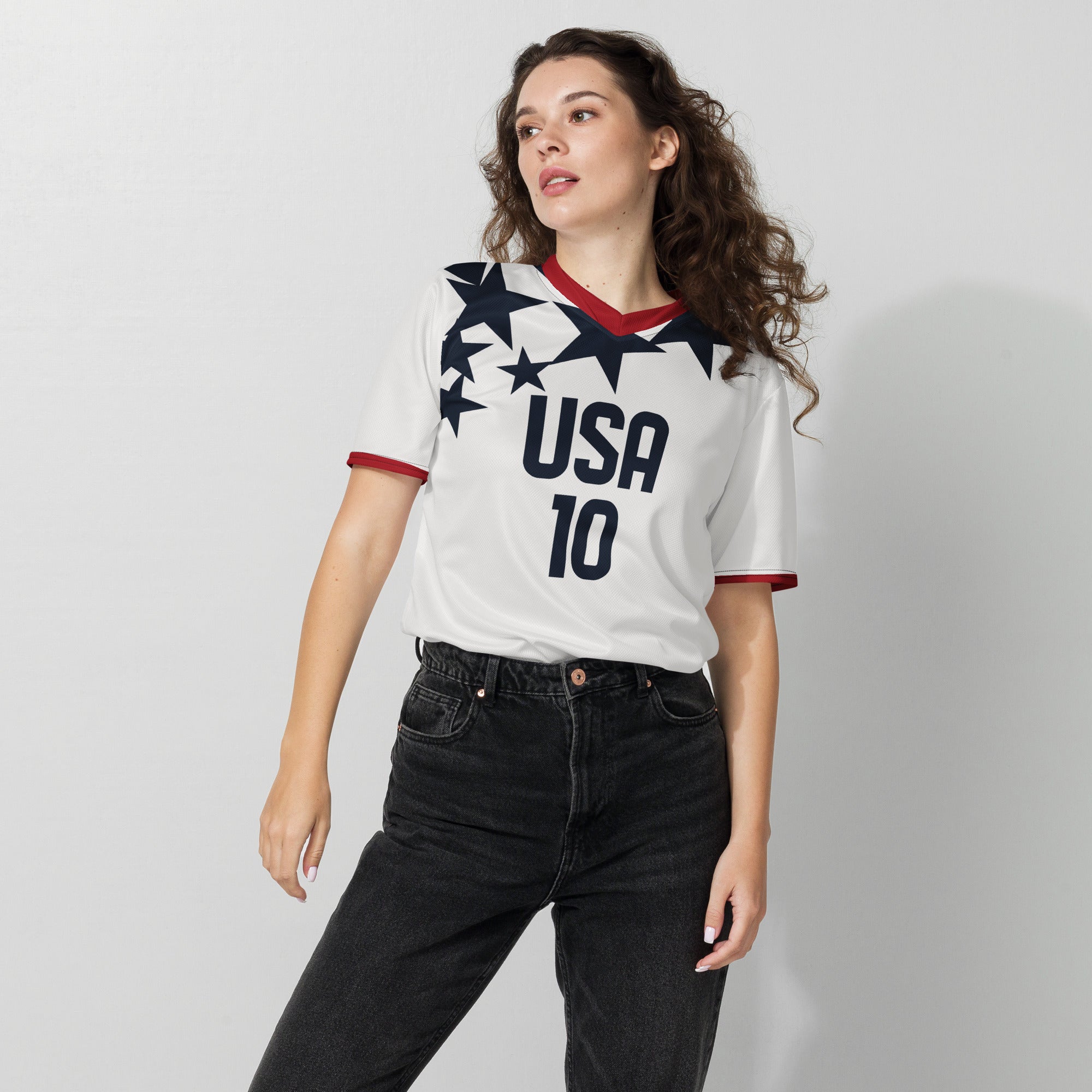 all-over-print-recycled-unisex-sports-jersey-USA-_star-edition-soccer-jersey-_10-navy-base-with-red-and-white-diagonal-strike-premium-national-team-fanwear-female-model-front-view