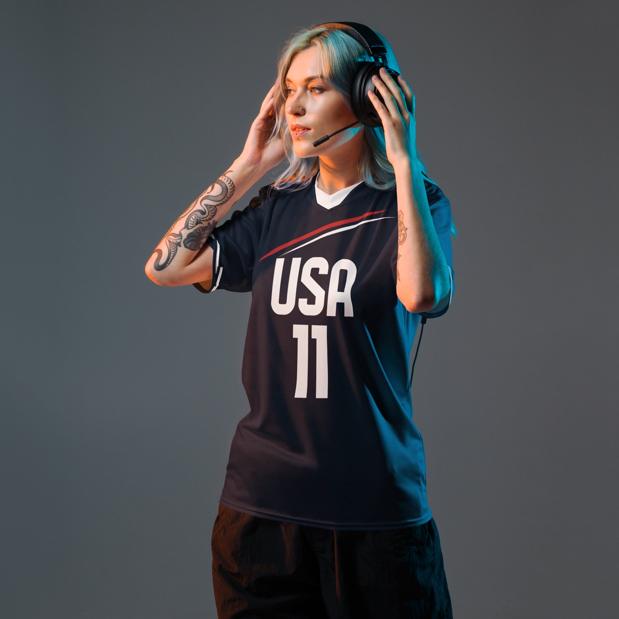all-over-print-recycled-unisex-sports-jersey-_11-USA-Midnight-Strike-soccer-jersey-navy-base-with-red-and-white-diagonal-strike-premium-national-team-fanwear-front-female-model-view
