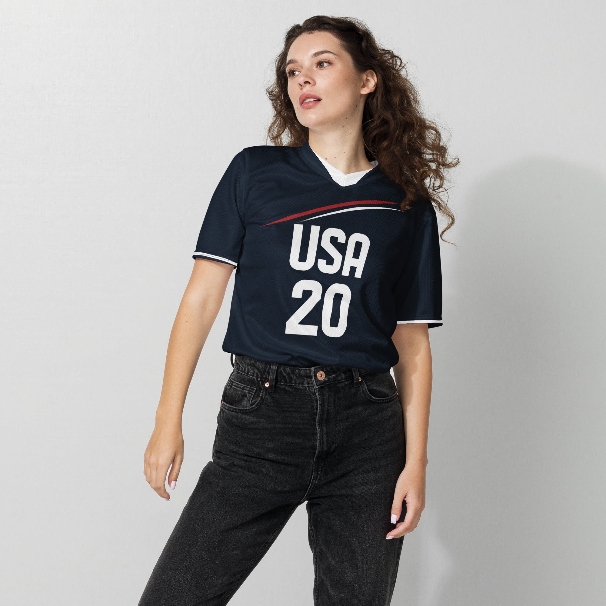 all-over-print-recycled-unisex-sports-jersey-_20-USA-Midnight-Strike-soccer-jersey-navy-base-with-red-and-white-diagonal-strike-premium-national-team-fanwear-female-model-front-view