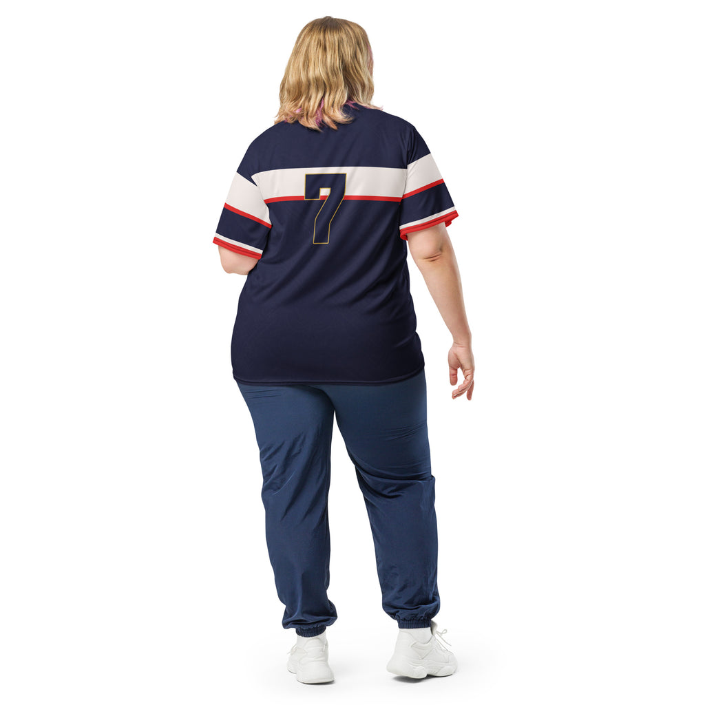 all-over-print-recycled-unisex-sports-jersey-France-Bleu-Majesté-edition-soccer-jersey-royal-blue-base-with-white-chest-band-and-gold-FRANCE-branding-premium-national-team-fanwear-model-back-view2-female-model