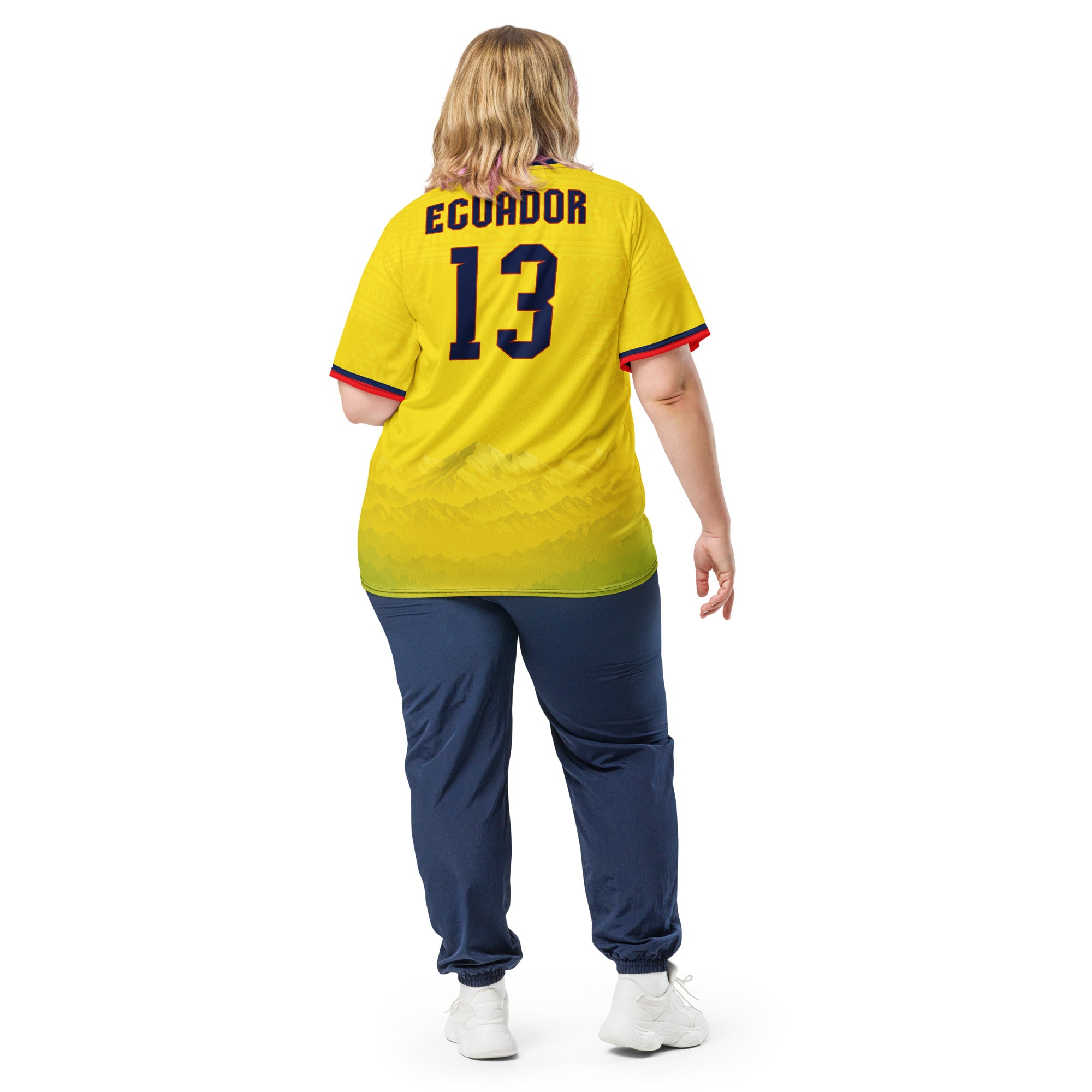 all-over-print-recycled-unisex-sports-jersey-Ecuador-Condor-soccer-jersey-yellow-base-with-mountain-silhouette-and-navy red-accents-premium-national-team-fanwear-model-back-view2-female-model