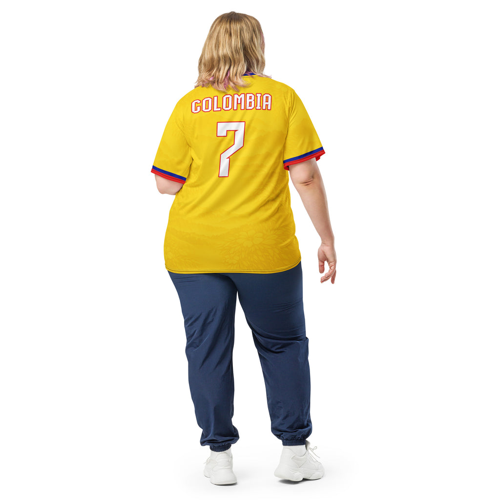 all-over-print-recycled-unisex-sports-jersey-Colombia-Pasión-Cafetera-soccer-jersey-golden-base-with-tricolor-sash-and-coffee leaf-motifs-premium-national-team-fanwear-model-back-view2-female-model