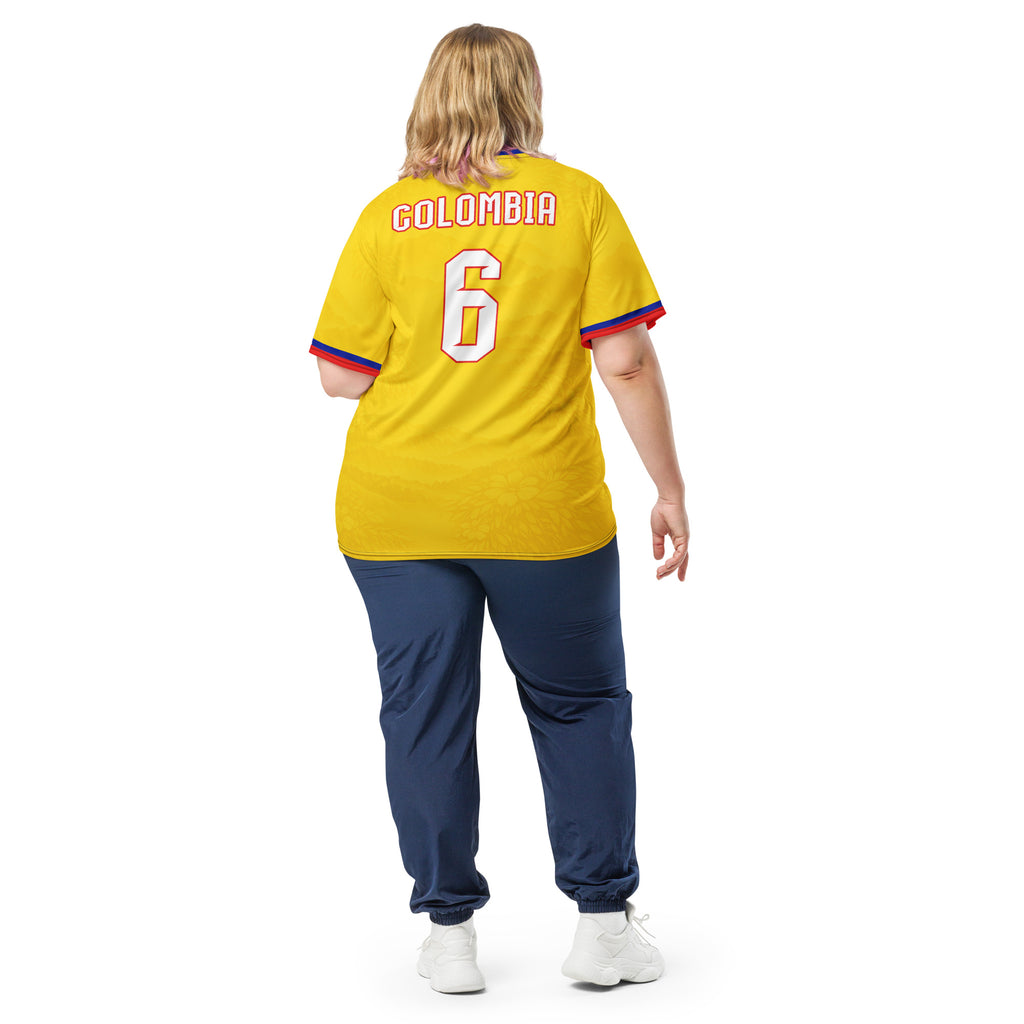 all-over-print-recycled-unisex-sports-jersey-Colombia-Pasión-Cafetera-soccer-jersey-golden-base-with-tricolor-sash-and-coffee leaf-motifs-premium-national-team-fanwear-model-back-view2-female-model