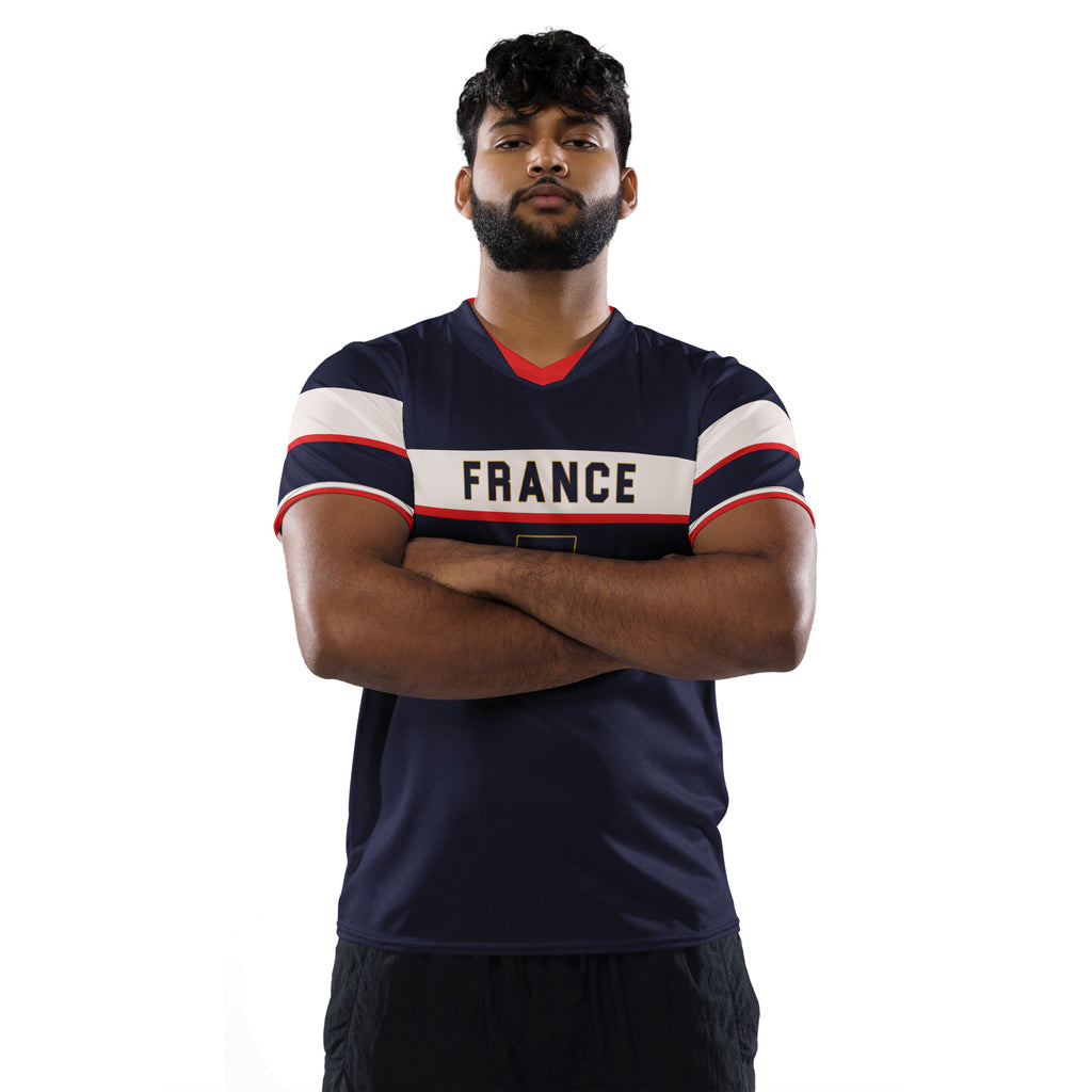 all-over-print-recycled-unisex-sports-jersey-France-Bleu-Majesté-edition-soccer-jersey-royal-blue-base-with-white-chest-band-and-gold-FRANCE-branding-premium-national-team-fanwear-male-model-front-view