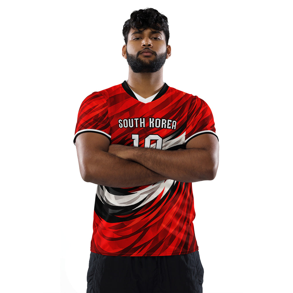 all-over-print-recycled-unisex-sports-jersey-South-Korea-Taegeuk-soccer-jersey- crimson-base-with-sweeping-red black white-wave-design-premium-national-team-fanwear-male-model-front-view
