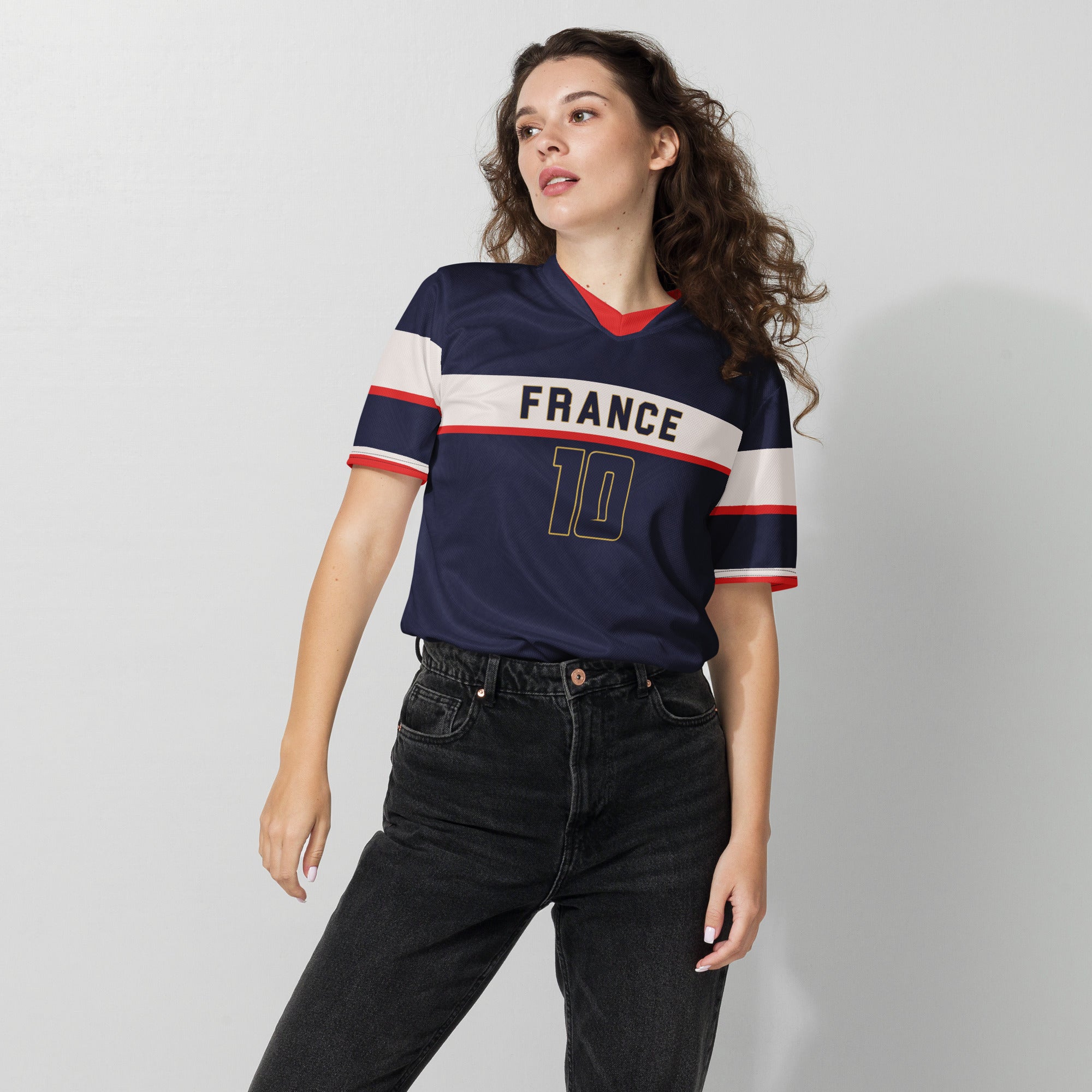 all-over-print-recycled-unisex-sports-jersey-France-Bleu-Majesté-edition-soccer-jersey-royal-blue-base-with-white-chest-band-and-gold-FRANCE-branding-premium-national-team-fanwear-female-model-front-view