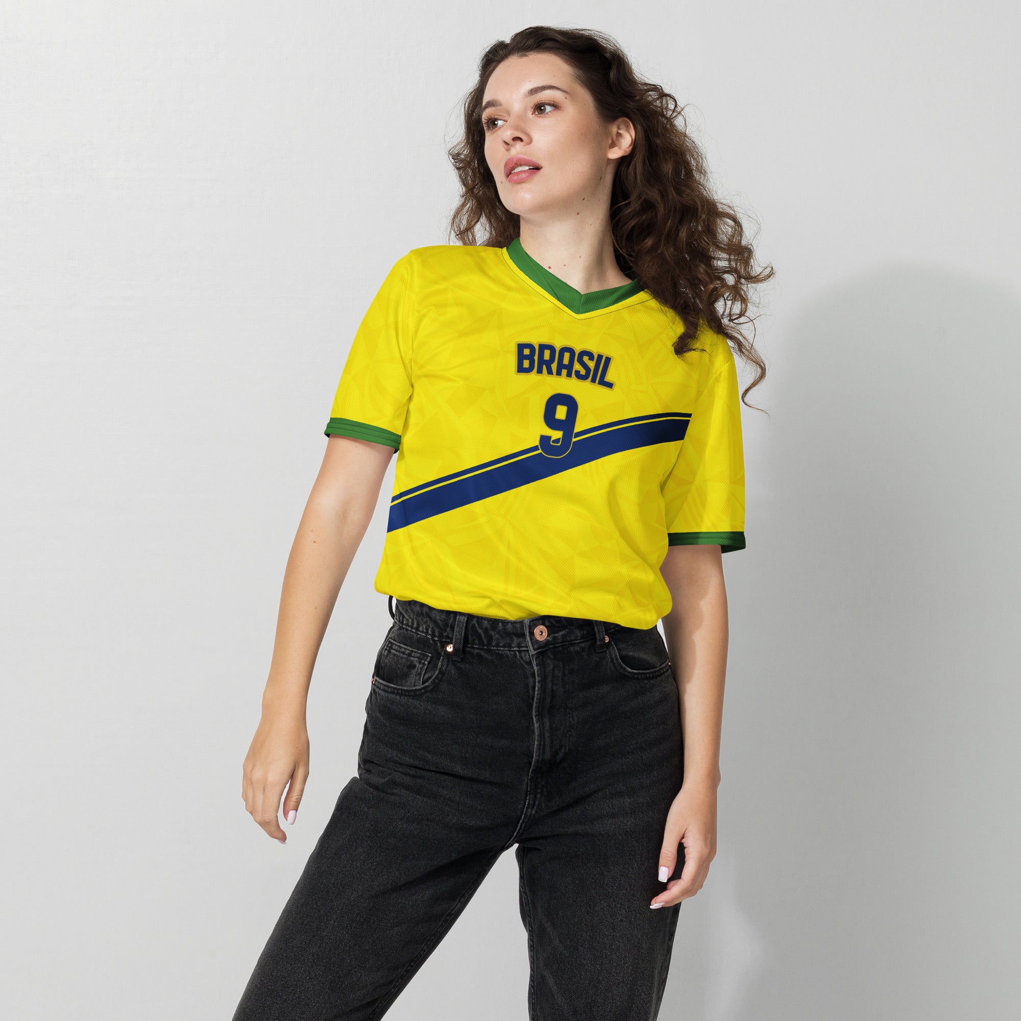 all-over-print-recycled-unisex-sports-jersey-#9-Brazil-Aurora-Amarela-edition-soccer-jersey-vibrant-yellow-with-blue-diagonal-strike-and-geometric-pattern -premium-national-team-fanwear-female-model-front-view