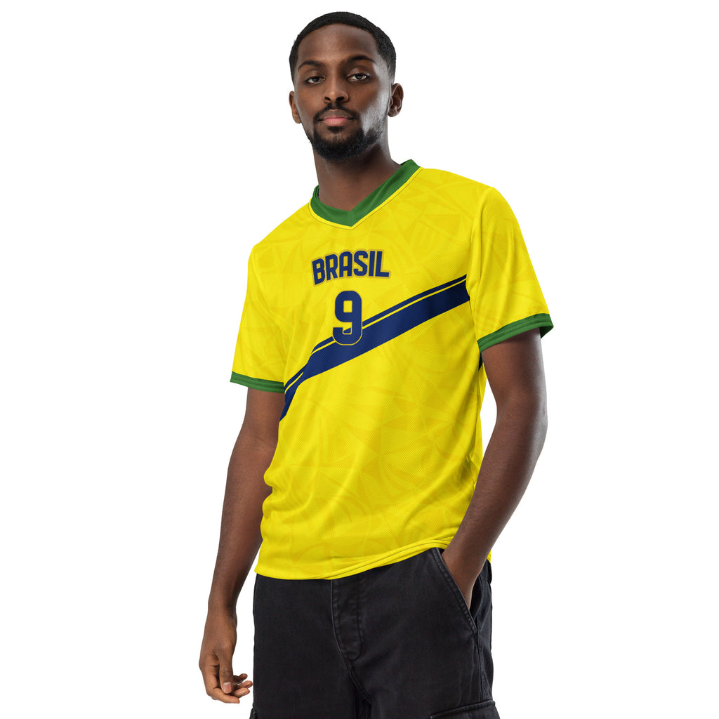all-over-print-recycled-unisex-sports-jersey-#9-Brazil-Aurora-Amarela-edition-soccer-jersey-vibrant-yellow-with-blue-diagonal-strike-and-geometric-pattern-premium-national-team-fanwear-model-front-view-male-model
