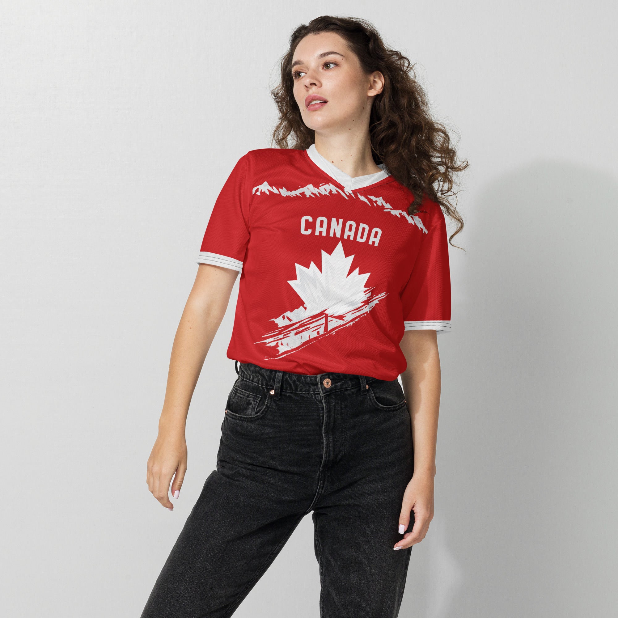 all-over-print-recycled-unisex-sports-jersey-#9-Canada-Northern-Pulse-edition-soccer-jersey-#-red-base-with- with-maple-leaf-and-mountain-graphics-premium-national-team-fanwear-female-model-front-view