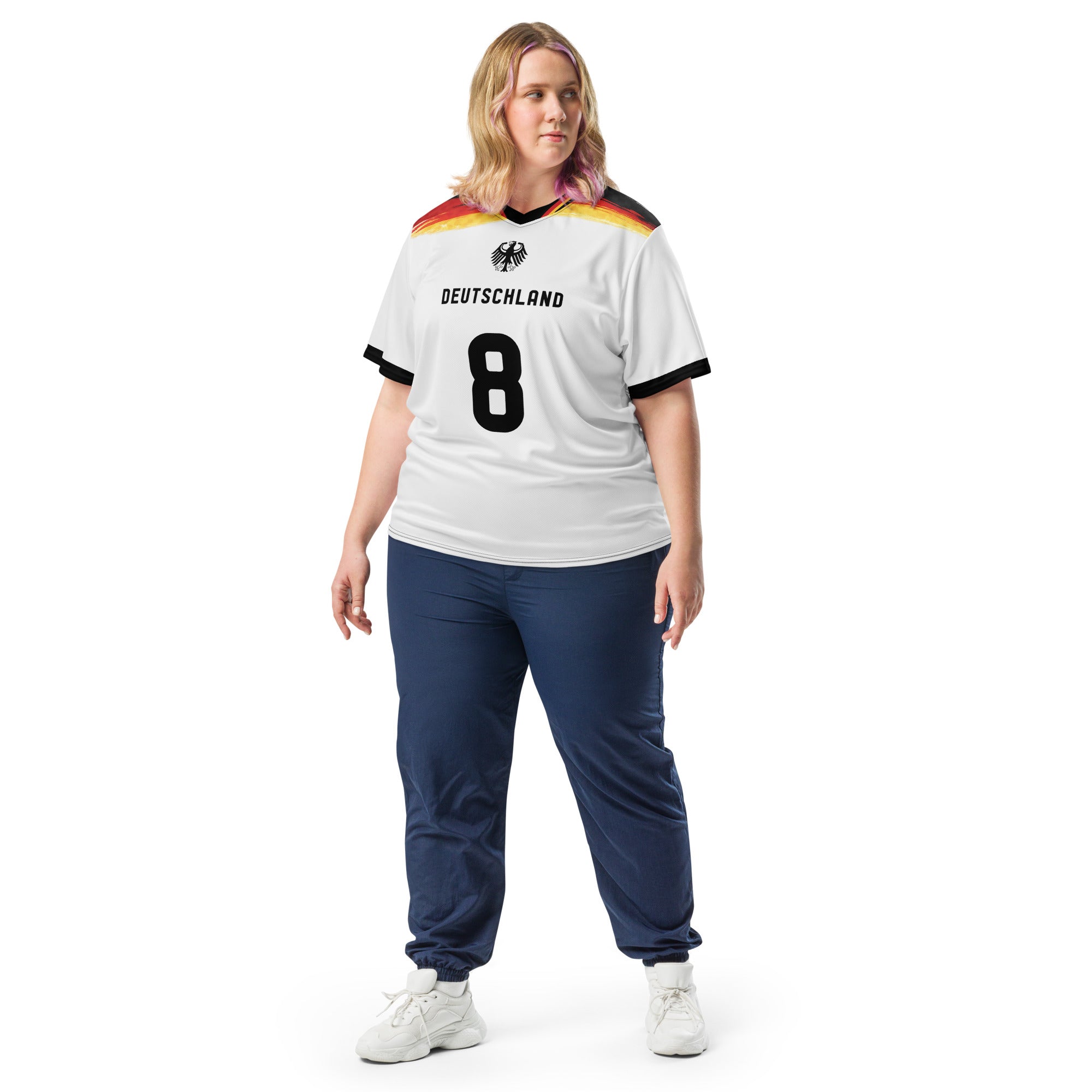 all-over-print-recycled-unisex-sports-jersey-Germany Horizon-edition-soccer-jersey-black-sleeves-with-tricolor-brushstroke-band-and-gold red black-trim-pattern-premium-national-team-fanwear-model-front-view2-female-model