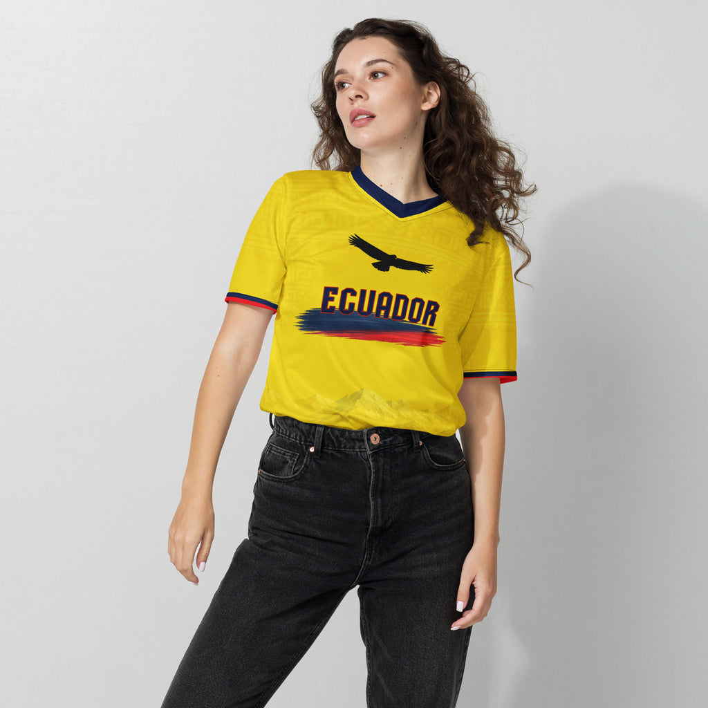 all-over-print-recycled-unisex-sports-jersey-Ecuador-Condor-soccer-jersey-yellow-base-with-mountain-silhouette-and-navy red-accents-premium-national-team-fanwear-female-model-front-view
