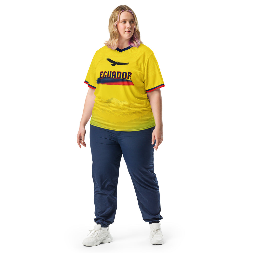 all-over-print-recycled-unisex-sports-jersey-Ecuador-Condor-soccer-jersey-yellow-base-with-mountain-silhouette-and-navy red-accents-premium-national-team-fanwear-model-front-view2-female-model