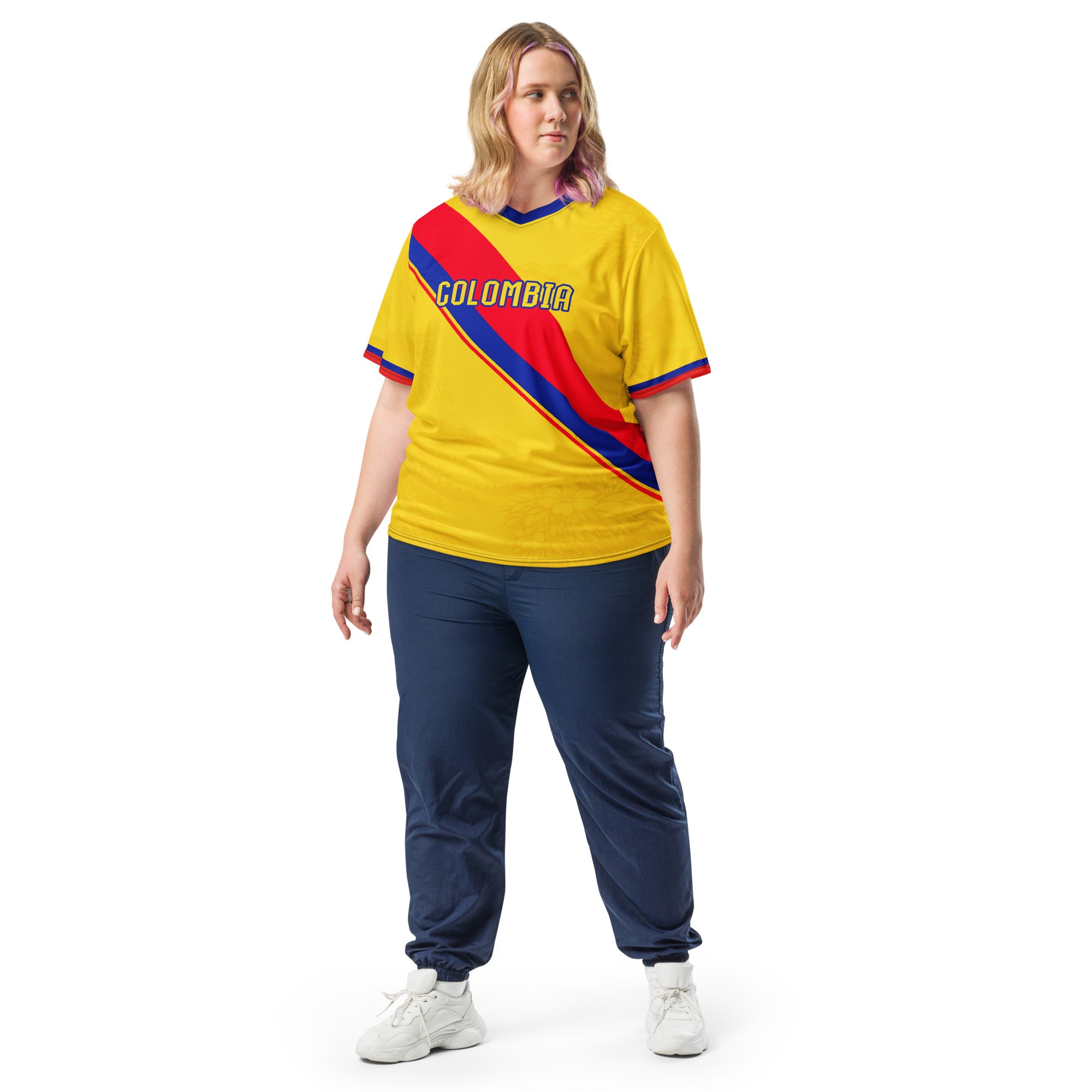 all-over-print-recycled-unisex-sports-jersey-Colombia-Pasión-Cafetera-soccer-jersey-golden-base-with-tricolor-sash-and-coffee leaf-motifs-premium-national-team-fanwear-model-front-view2-female-model