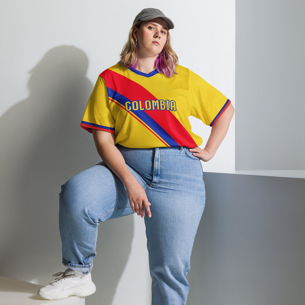 all-over-print-recycled-unisex-sports-jersey-Colombia-Pasión-Cafetera-soccer-jersey-golden-base-with-tricolor-sash-and-coffee leaf-motifs-premium-national-team-fanwear-model-front-view2-female