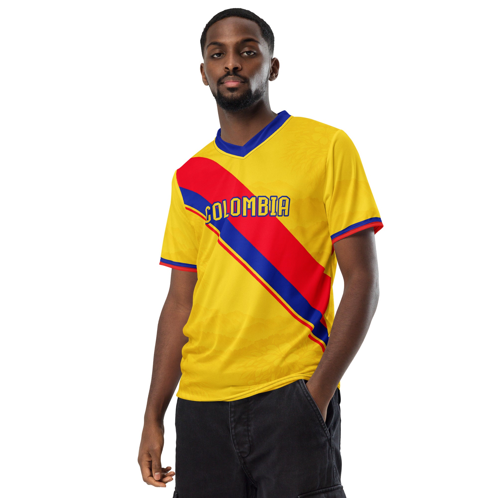 all-over-print-recycled-unisex-sports-jersey-Colombia-Pasión-Cafetera-soccer-jersey-golden-base-with-tricolor-sash-and-coffee leaf-motifs-premium-national-team-fanwear-model-front-view-male-model