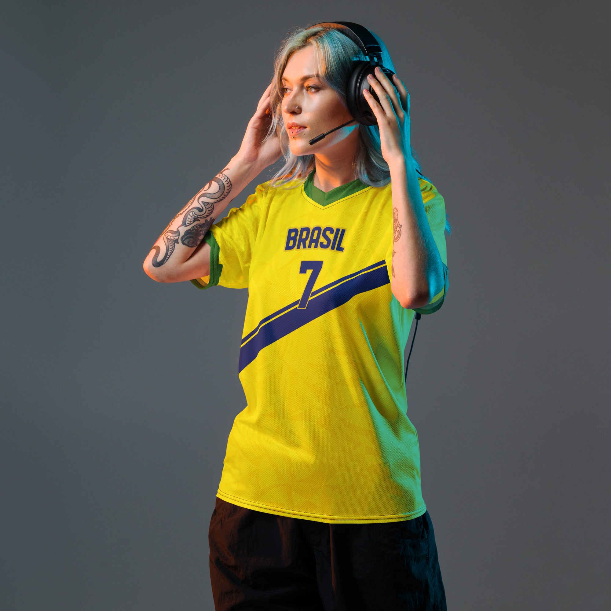 all-over-print-recycled-unisex-sports-jersey-#7-Brazil-Aurora-Amarela-edition-soccer-jersey-vibrant-yellow-with-blue-diagonal-strike-and-geometric-pattern-premium-national-team-fanwear-model-front-view-female-model