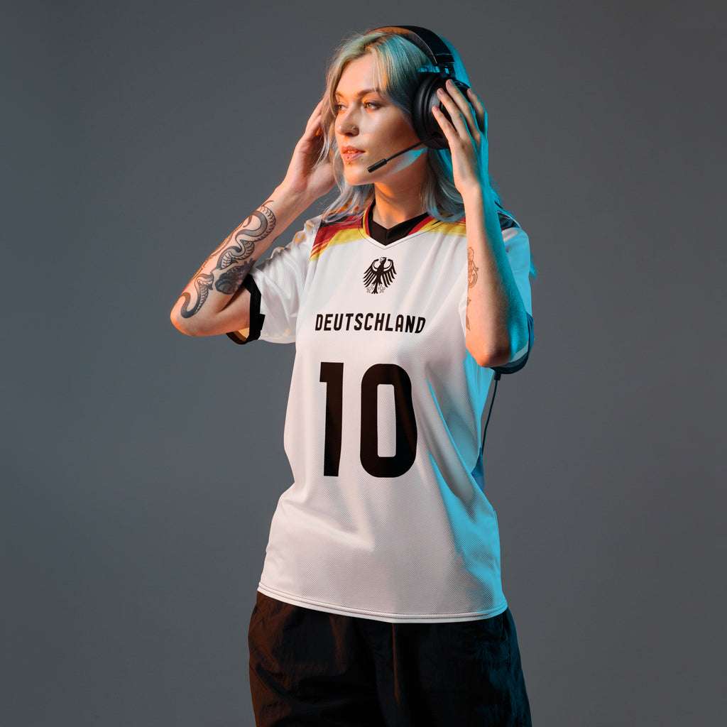 all-over-print-recycled-unisex-sports-jersey-Germany Horizon-edition-soccer-jersey-black-sleeves-with-tricolor-brushstroke-band-and-gold red black-trim-pattern-premium-national-team-fanwear-model-front-view-female-model
