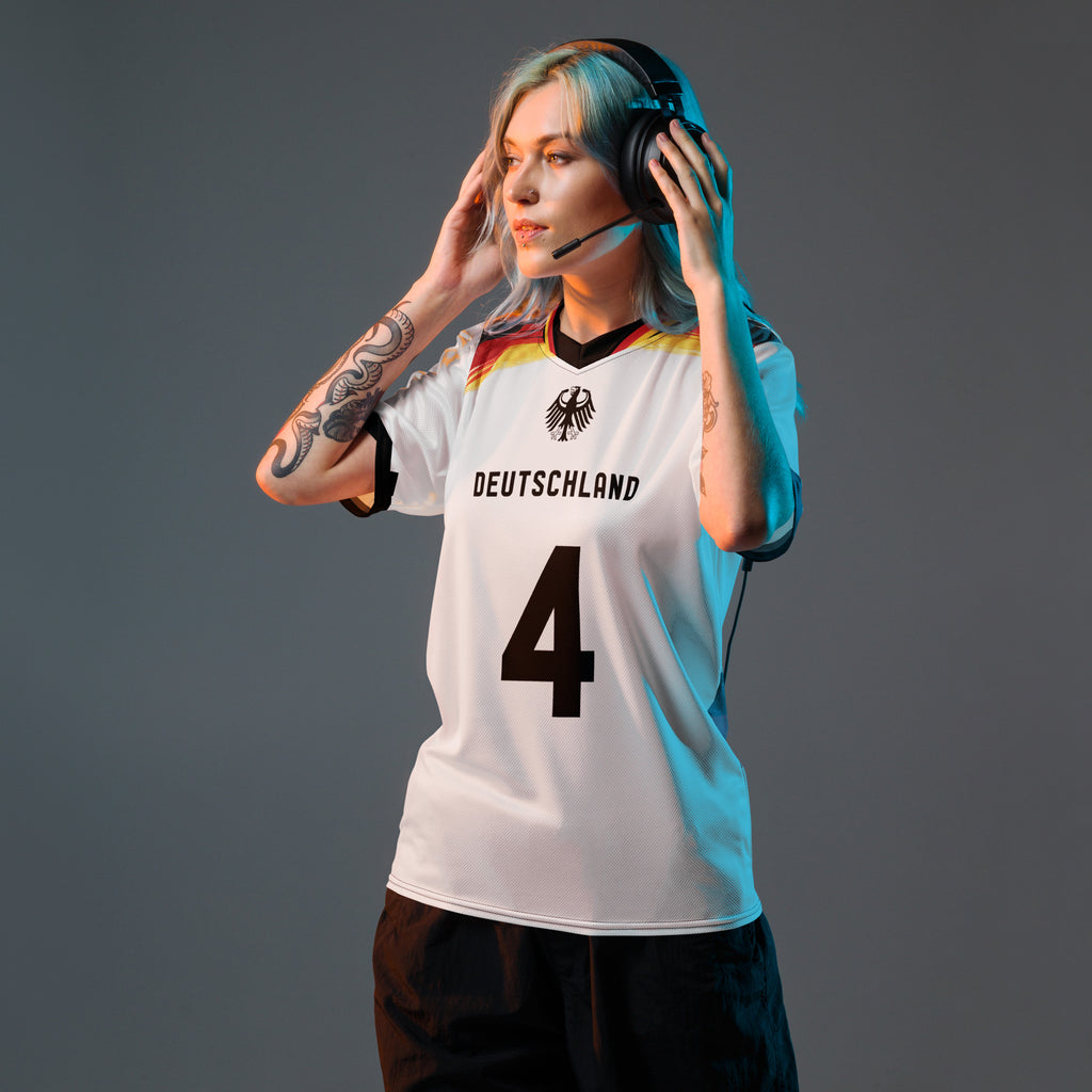 all-over-print-recycled-unisex-sports-jersey-Germany Horizon-edition-soccer-jersey-black-sleeves-with-tricolor-brushstroke-band-and-gold red black-trim-pattern-premium-national-team-fanwear-model-front-view-female-model