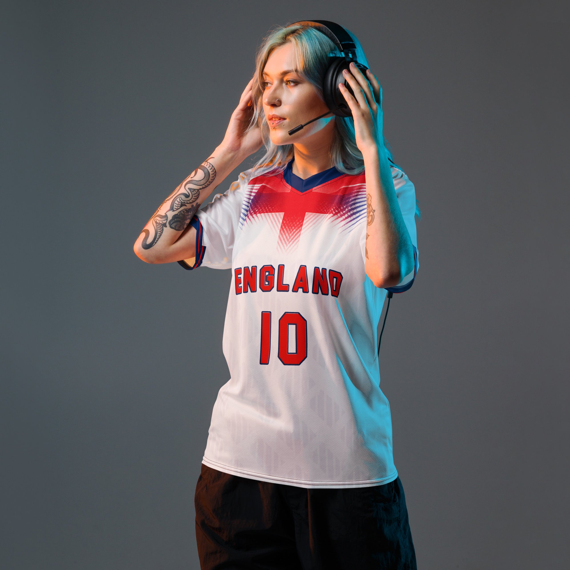 all-over-print-recycled-unisex-sports-jersey-#10-England-Lionheart-edition-soccer-jersey-vibrant-yellow-with-blue-diagonal-strike-and-geometric-pattern-premium-national-team-fanwear-model-front-view-female-model