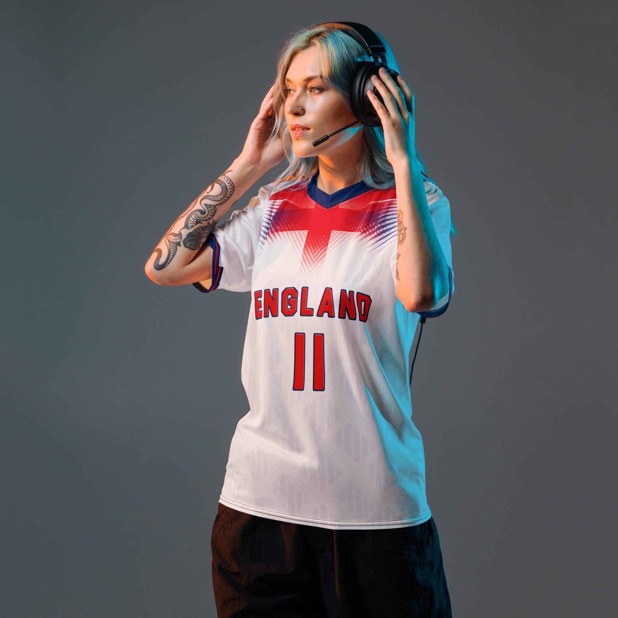 all-over-print-recycled-unisex-sports-jersey-#11-England-Lionheart-edition-soccer-jersey-vibrant-yellow-with-blue-diagonal-strike-and-geometric-pattern-premium-national-team-fanwear-model-front-view-female-model