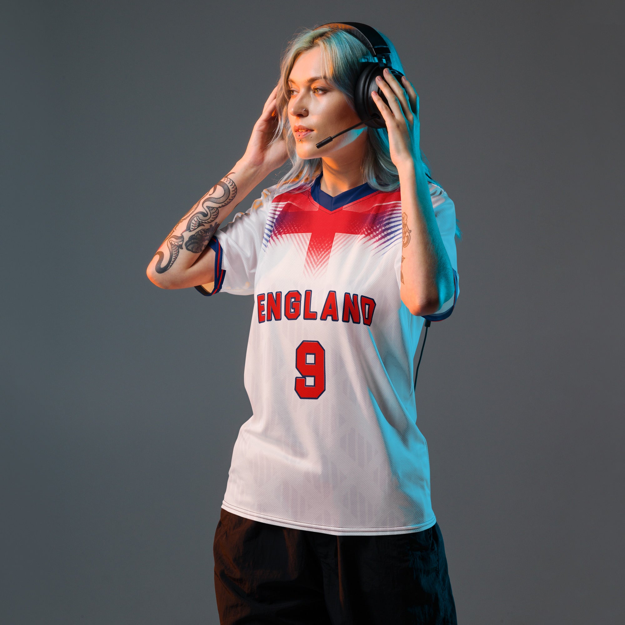 all-over-print-recycled-unisex-sports-jersey-#9-England-Lionheart-edition-soccer-jersey-vibrant-yellow-with-blue-diagonal-strike-and-geometric-pattern-premium-national-team-fanwear-model-front-view-female-model