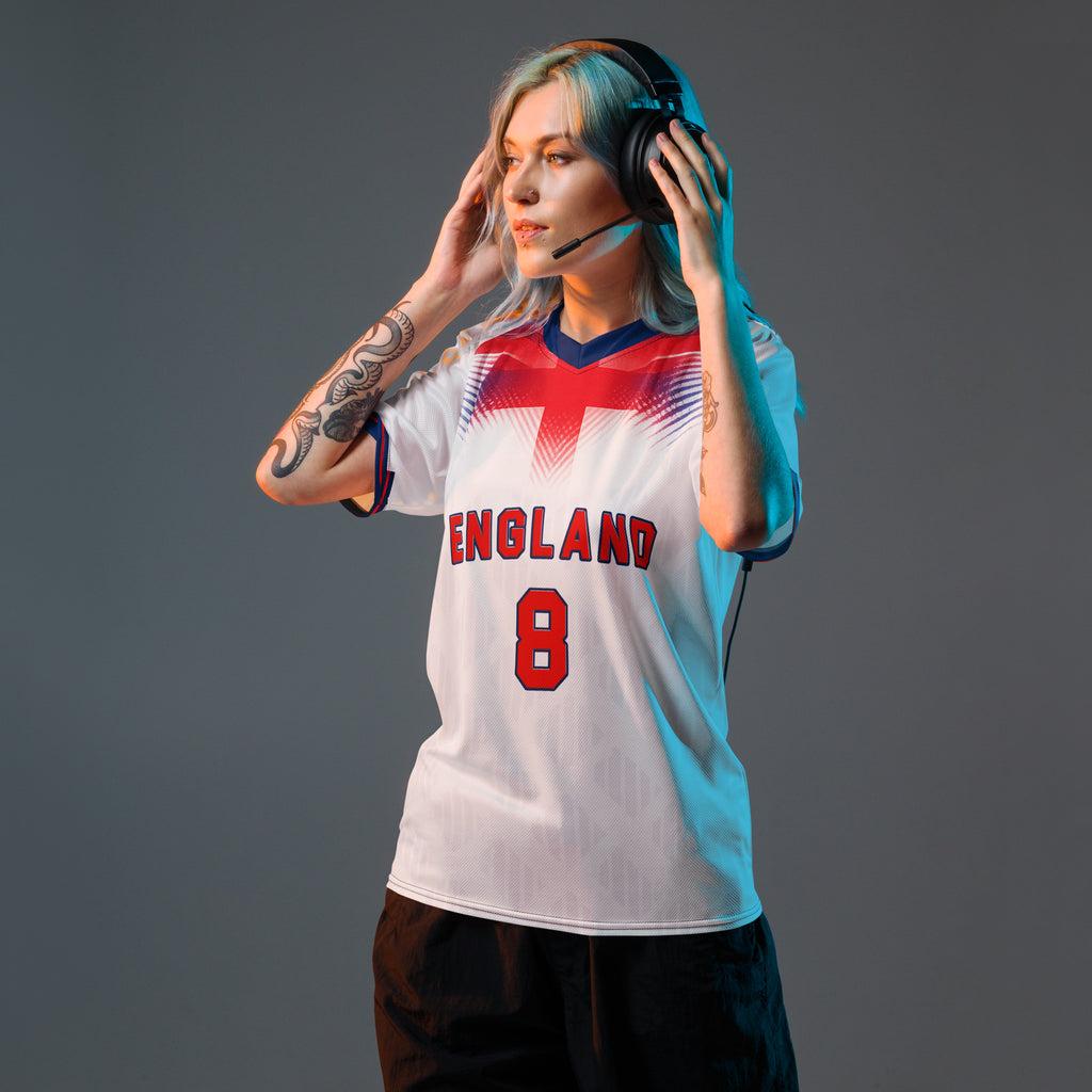 all-over-print-recycled-unisex-sports-jersey-#8-England-Lionheart-edition-soccer-jersey-vibrant-yellow-with-blue-diagonal-strike-and-geometric-pattern-premium-national-team-fanwear-model-front-view-female-model