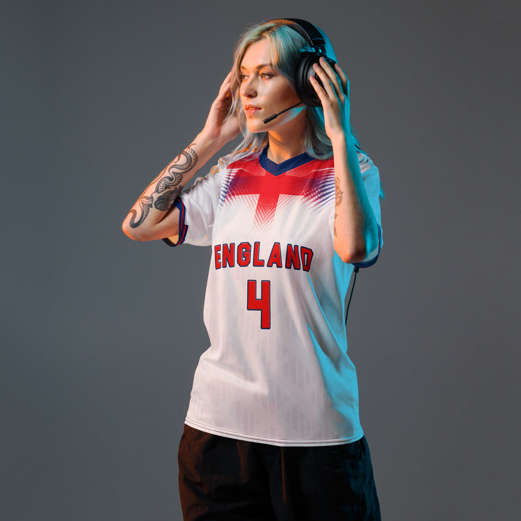 all-over-print-recycled-unisex-sports-jersey-#4-England-Lionheart-edition-soccer-jersey-vibrant-yellow-with-blue-diagonal-strike-and-geometric-pattern-premium-national-team-fanwear-model-front-view-female-model