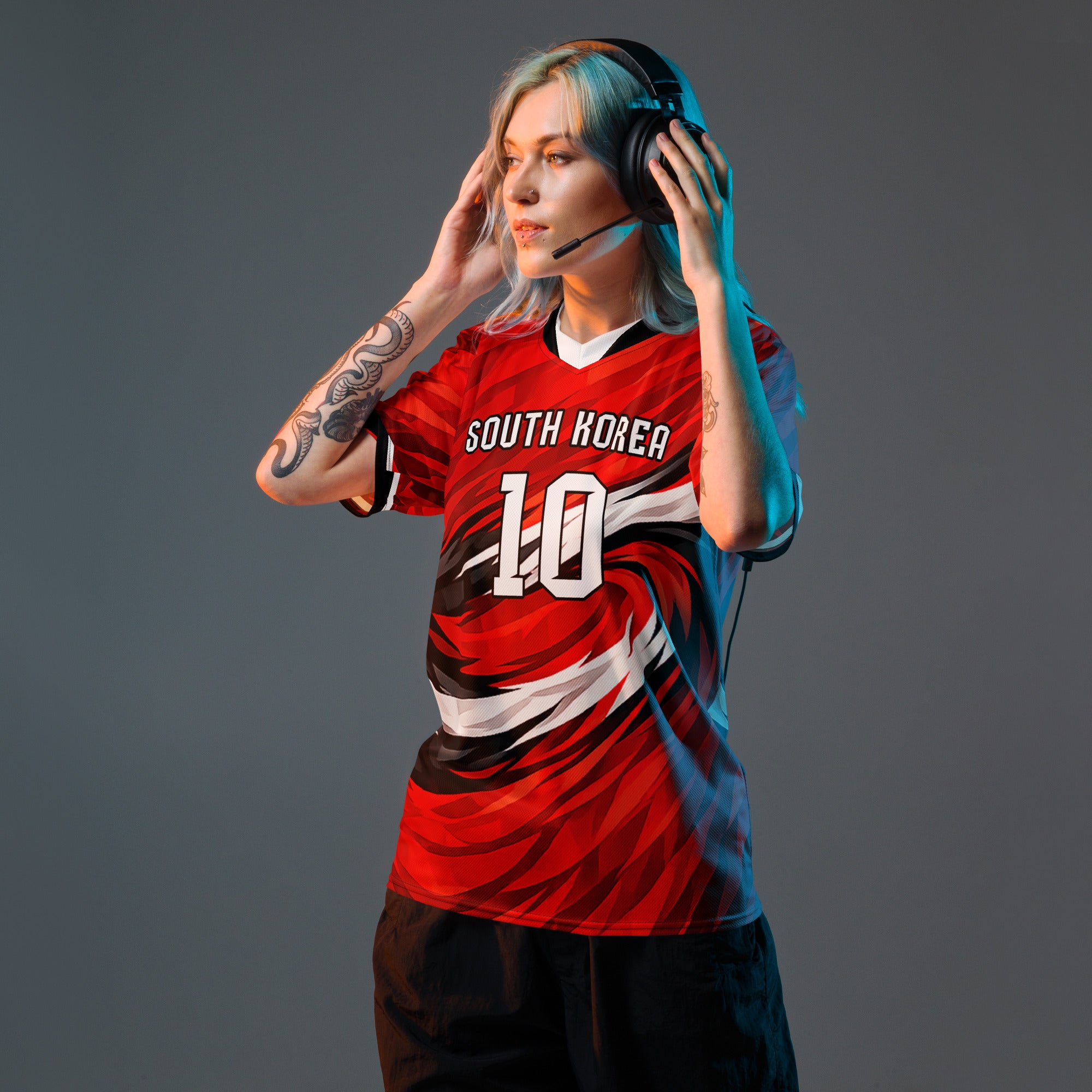 all-over-print-recycled-unisex-sports-jersey-South-Korea-Taegeuk-soccer-jersey- crimson-base-with-sweeping-red black white-wave-design-premium-national-team-fanwear-model-front-view-female-model