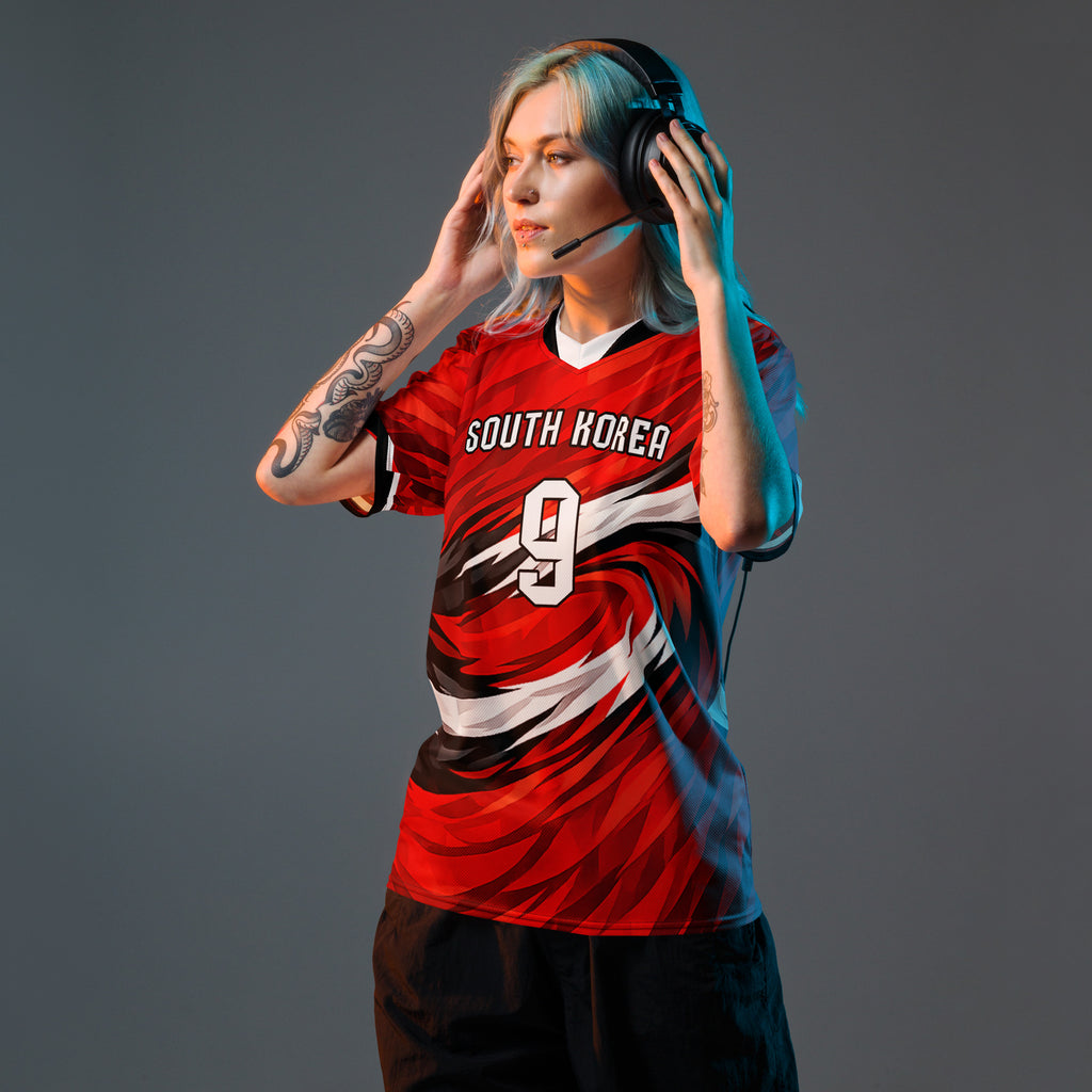 all-over-print-recycled-unisex-sports-jersey-South-Korea-Taegeuk-soccer-jersey- crimson-base-with-sweeping-red black white-wave-design-premium-national-team-fanwear-model-front-view-female-model