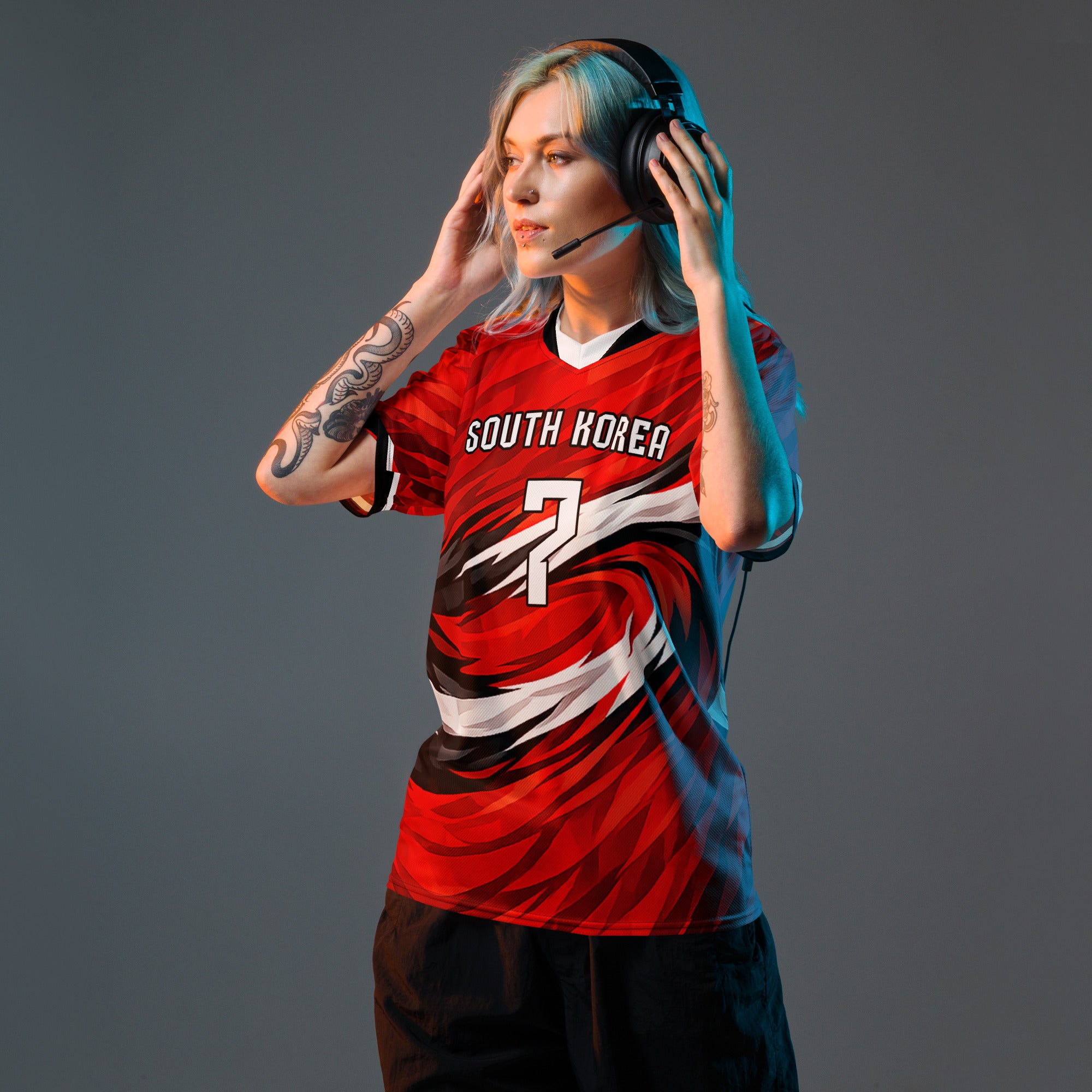 all-over-print-recycled-unisex-sports-jersey-South-Korea-Taegeuk-soccer-jersey- crimson-base-with-sweeping-red black white-wave-design-premium-national-team-fanwear-model-front-view-female-model