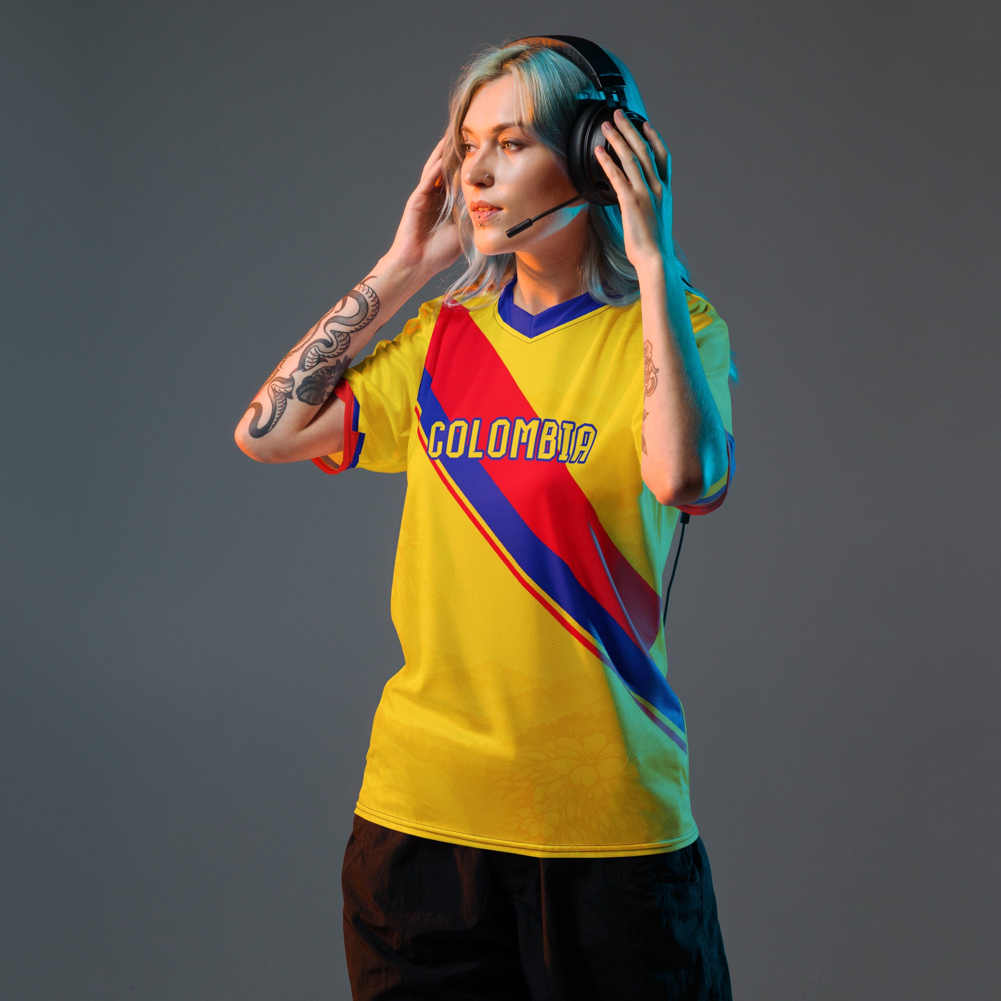 all-over-print-recycled-unisex-sports-jersey-Colombia-Pasión-Cafetera-soccer-jersey-golden-base-with-tricolor-sash-and-coffee leaf-motifs-premium-national-team-fanwear-model-front-view-female-model