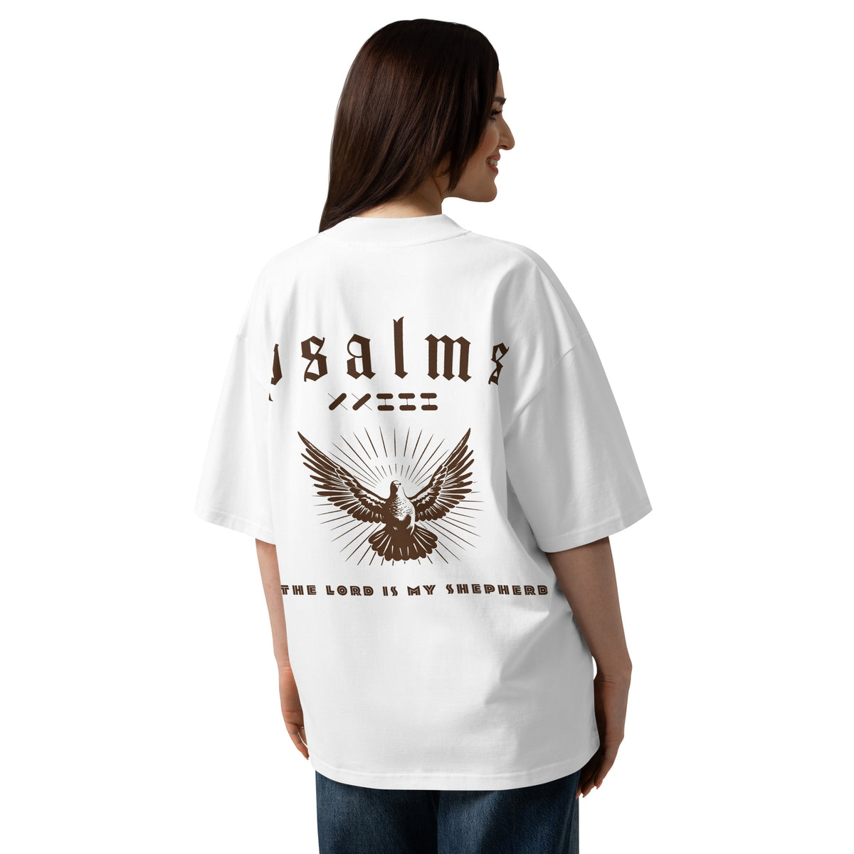 Female model wearing Oerigin's white oversized heavyweight streetwear "psalms 23" t-shirt on the back.